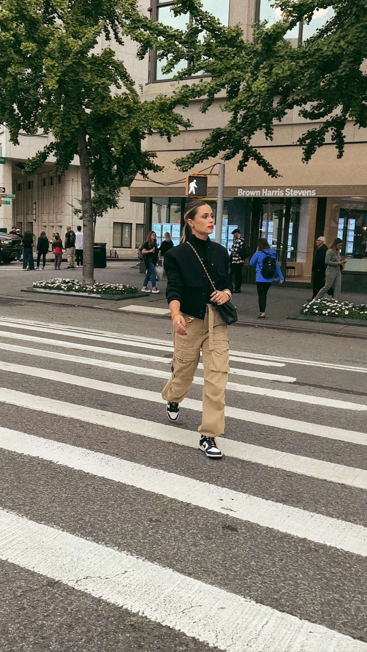 Elly wears cargo pants casually with panda dunks and a cropped bomber jacket from zara